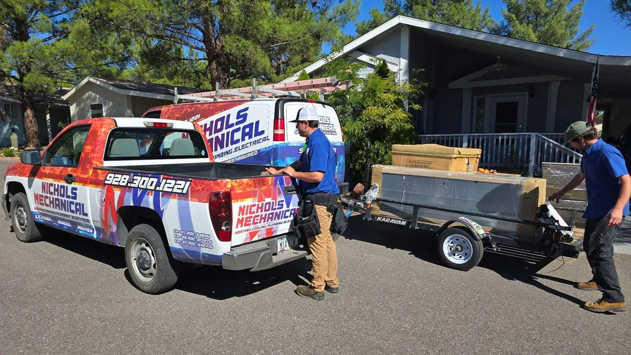 Nichols crew unloading a new HVAC system from a trailer