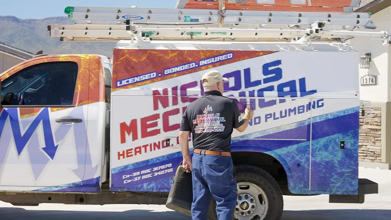 Nichols technician at the side of his service truck