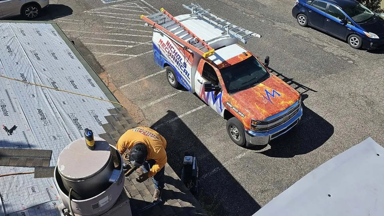 Nichols service truck at a commercial job site, seen from the roof