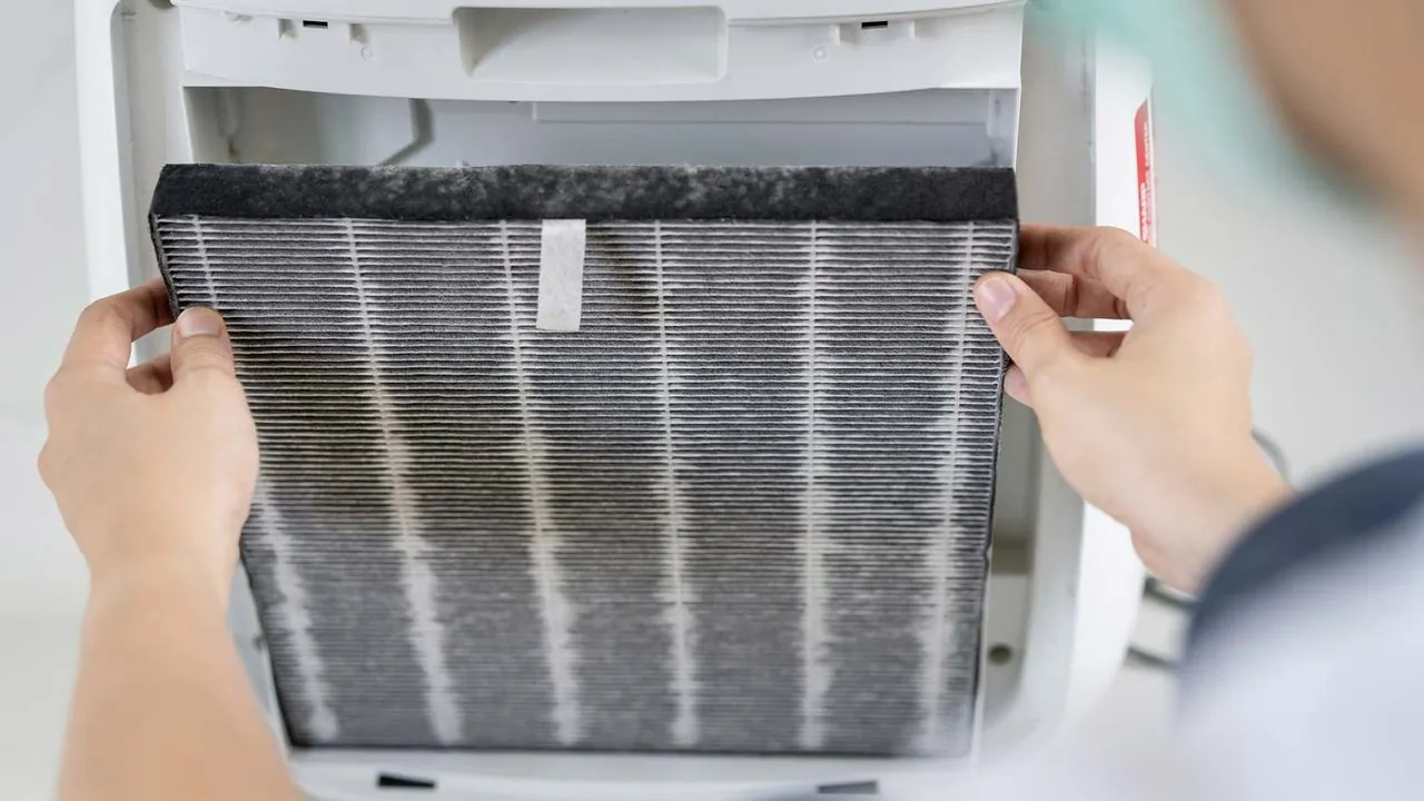 Removing a dirty pleated filter from a furnace
