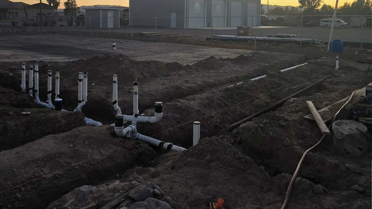 Underground plumbing rough-in at a new construction site