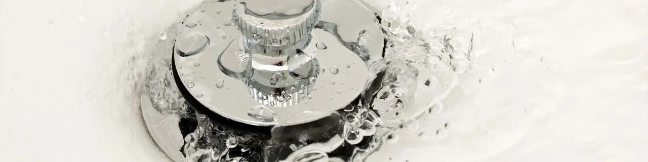 Water flowing down a bathtub drain