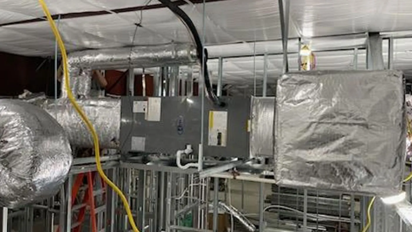 Commercial air handler and insulated ductwork during installation