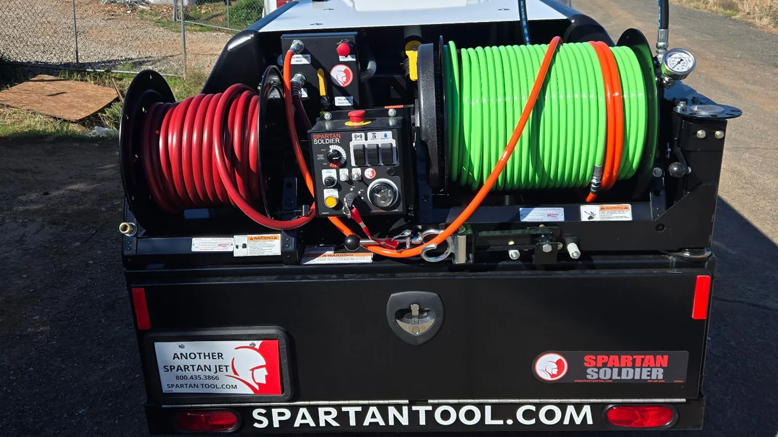 Hydro jetting machine hose reels and controls