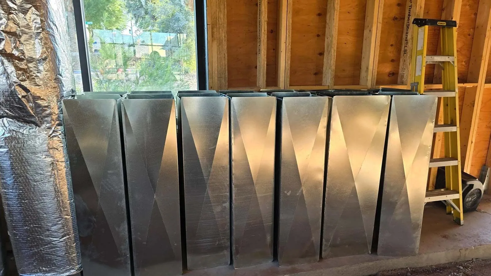 New sheet metal ductwork ready to install in a home under construction