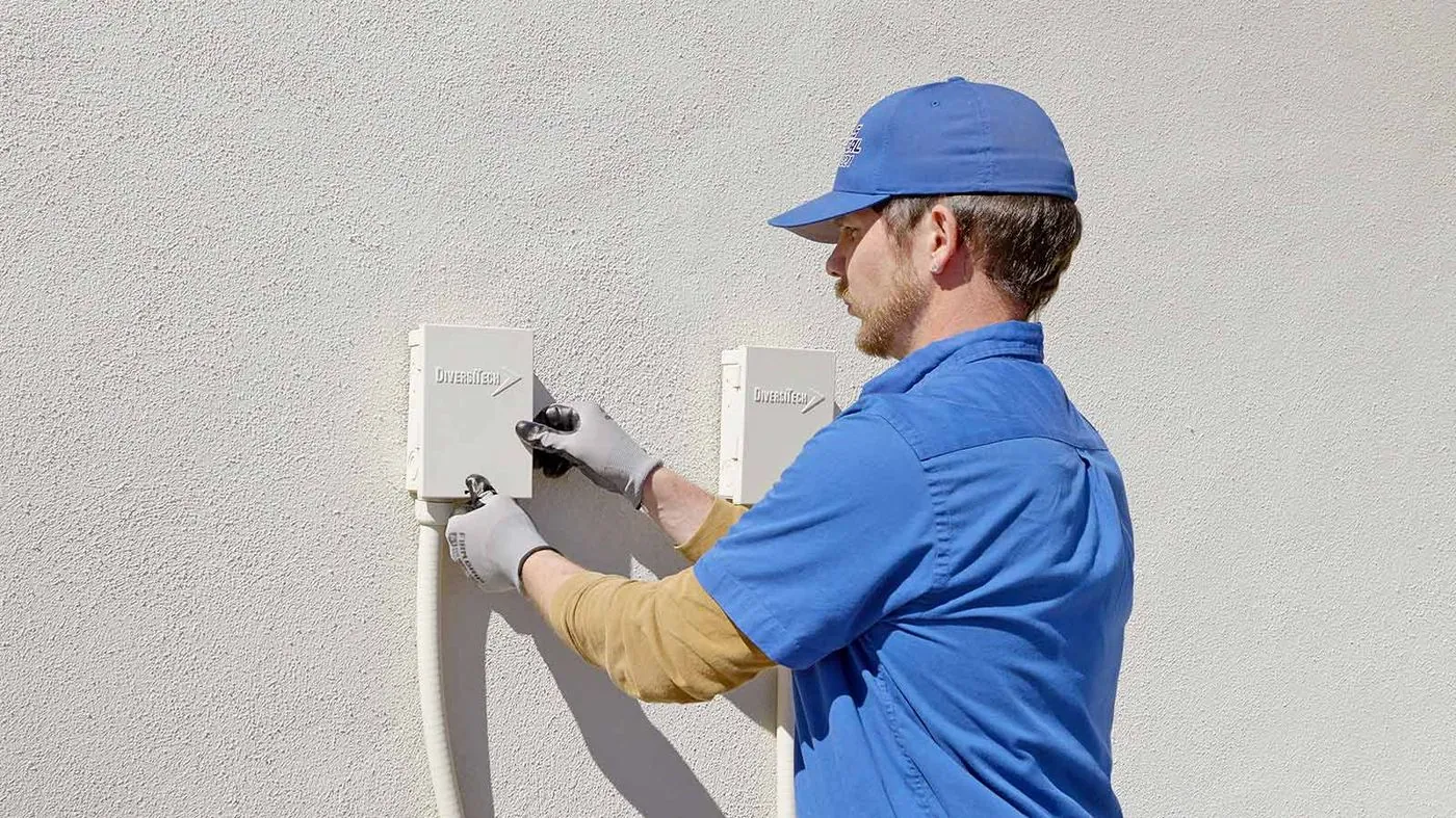 Nichols electrician wiring an exterior electrical box