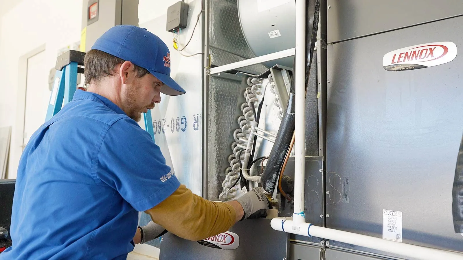 Nichols technician repairing an AC evaporator coil