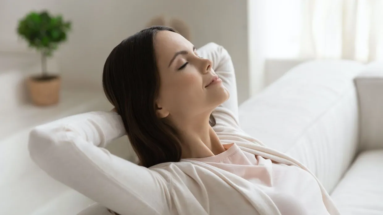 Woman relaxing on a couch at home